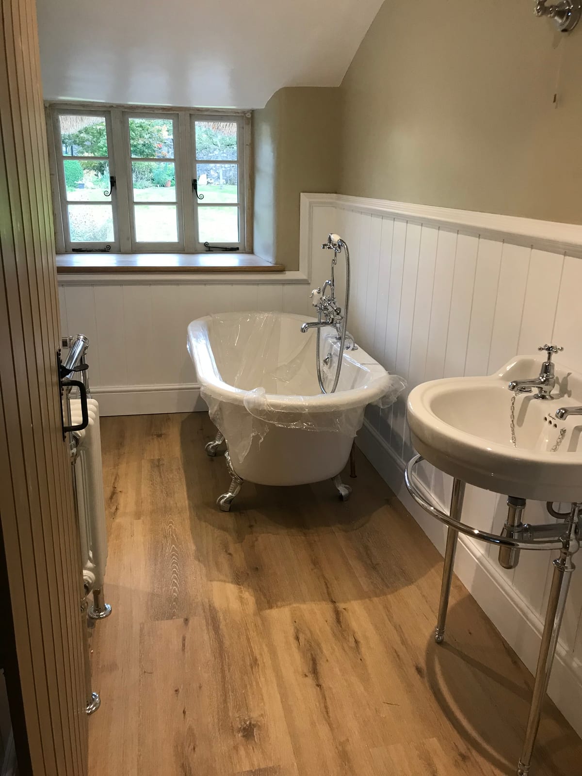 Traditional bathroom with freestanding clawfoot bath
